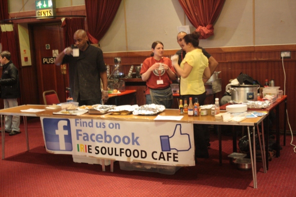 The Irie Soulfood Cafe staff (right) and founder (left) taking a short break as the crowds lessen.